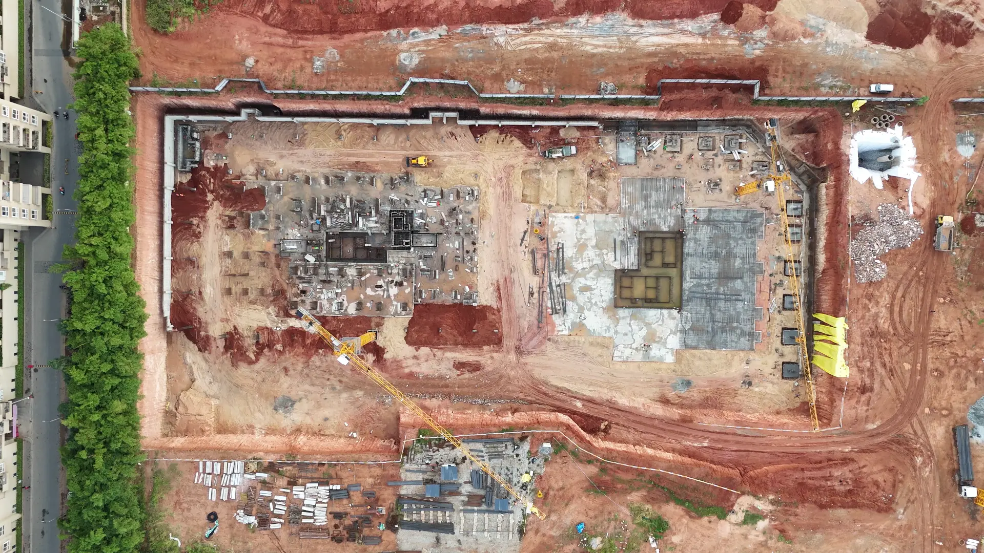 Wide view of excavation and foundation pours